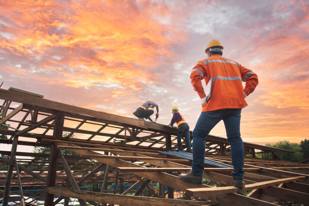 engineer inspects repair with sky full of clouds