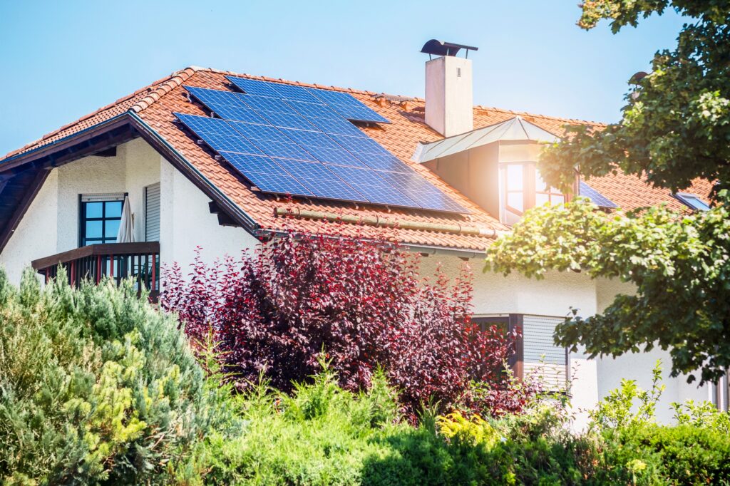 older home with solar panels on the roof
