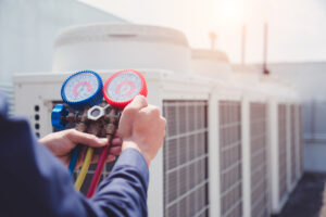 technician checking ac unit static pressure