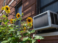 window ac unit with yellow flowers