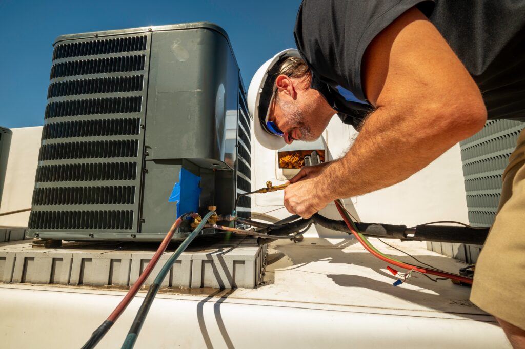 ac technician repairing a unit