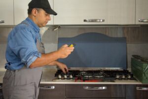 technician with a detector checking for a leak