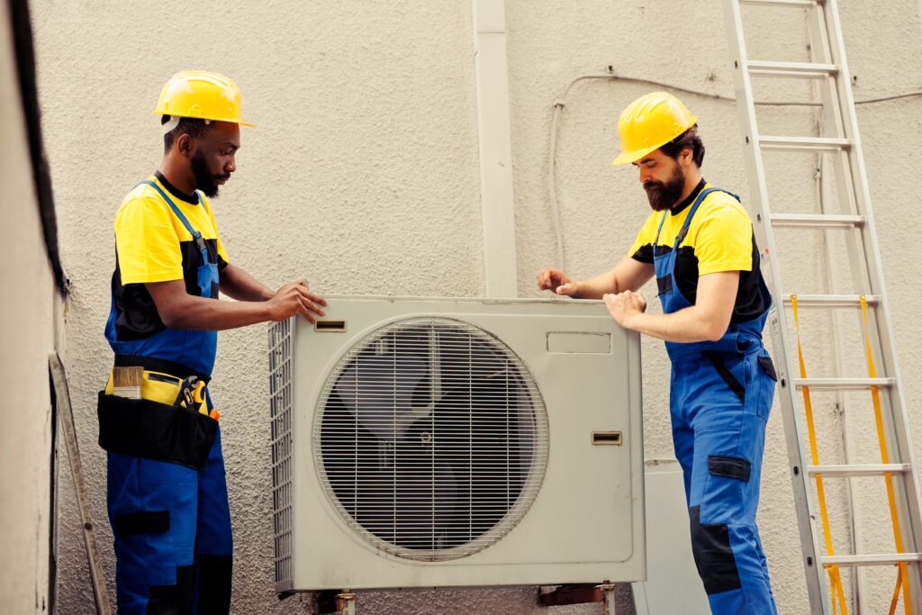 team of certified technicians working on broken hvac system