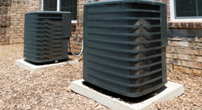 two outdoor ac units side by side