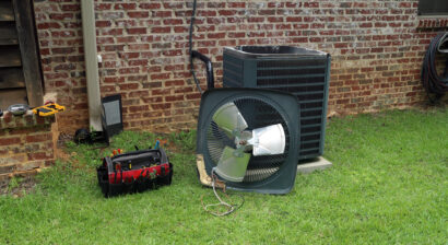 ac being taken apart in yard