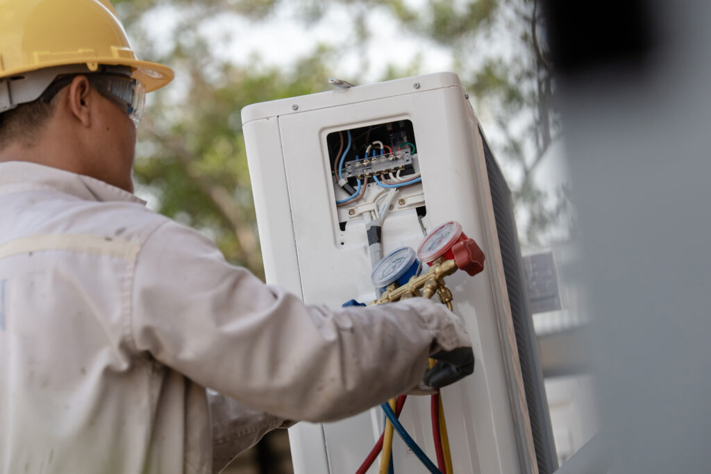 ac technician preparing to install