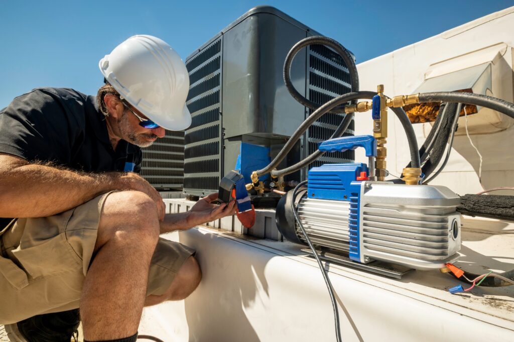 hvac technician monitoring an hvac system