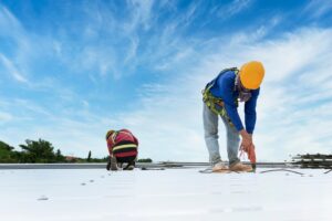 construction worker installing new roof