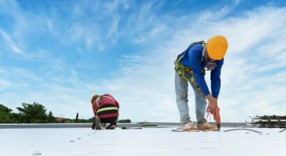construction worker installing new roof