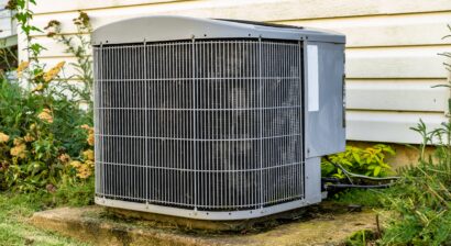 an ac unit sitting on a concrete pad