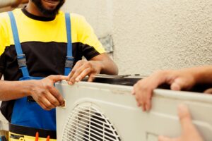 trained hvac technician opening faulty unit
