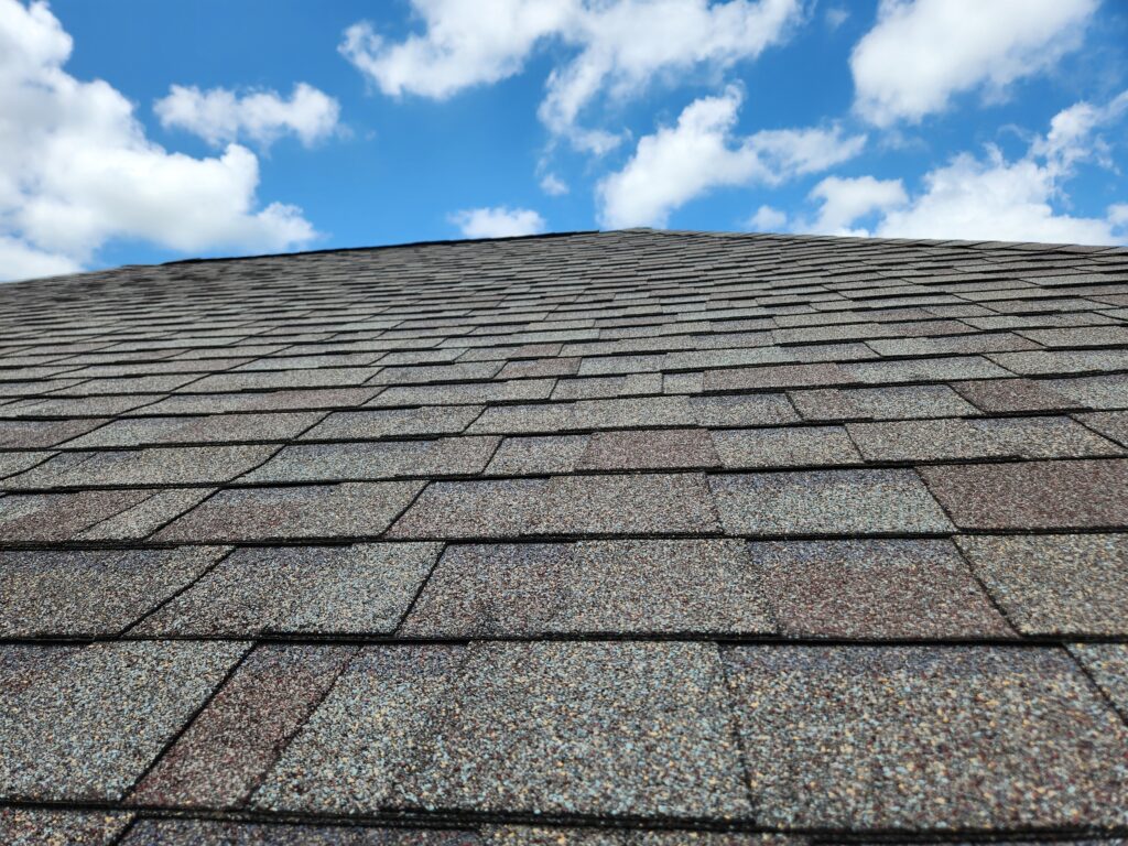 roof shingles against blue sky