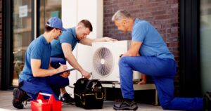technicians maintaining hvac system for commercial building
