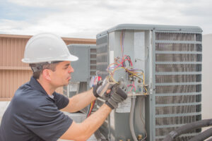 hvac technician working on a unit