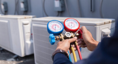 technician checking air conditioning unit