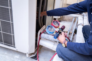 technician using ac measuring equipment