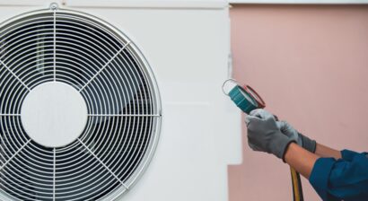 hvac technician measuring unit