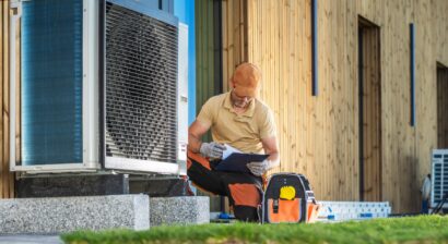 hvac technician working on a modern heat pump