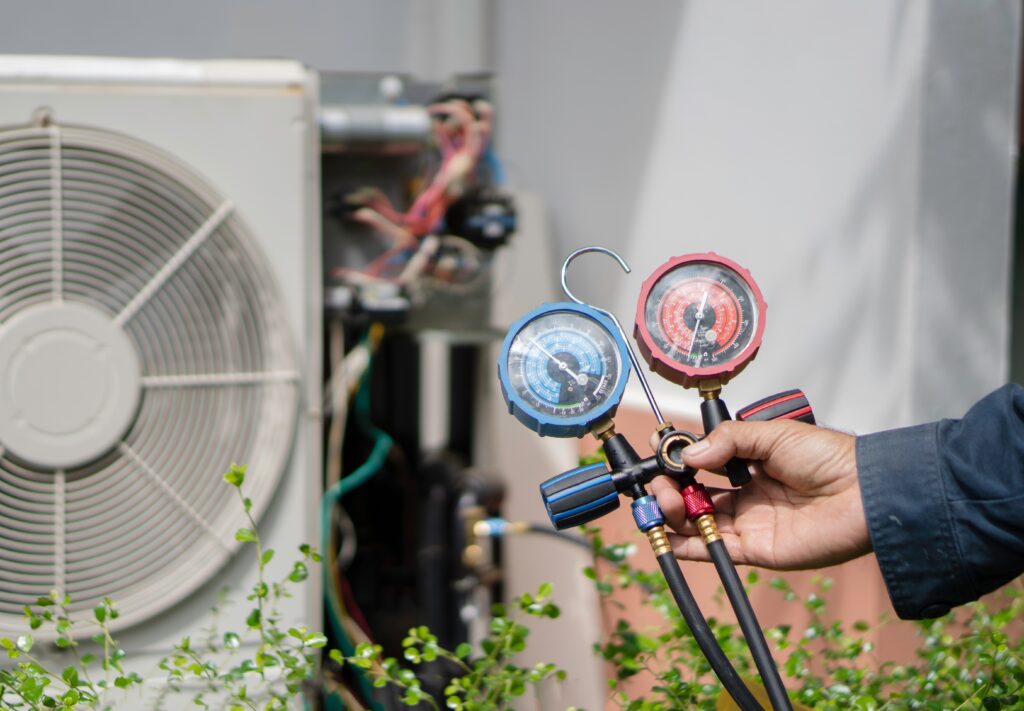 ac technician checking quality of unit