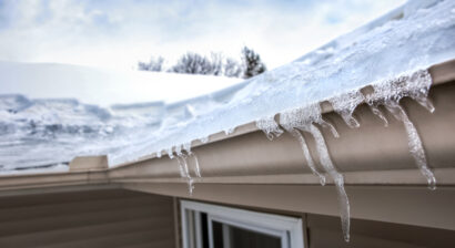 ice dam on gutter and ice freeze on roof