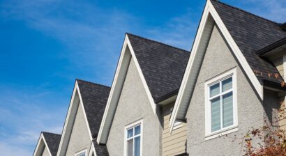 houses with shingle roof against blue sky