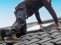 roofer installing a new roof window