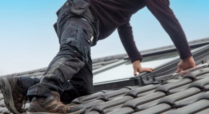 roofer installing a new roof window