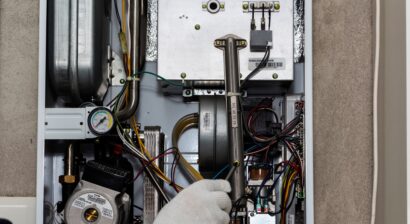 technician fixing a central heating issue