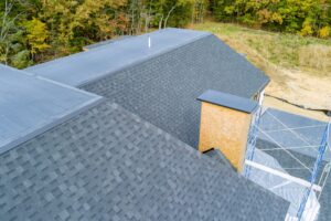 asphalt shingle roof over a newly built house