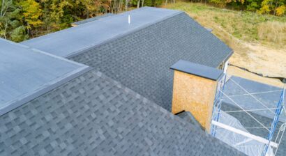 asphalt shingle roof over a newly built house