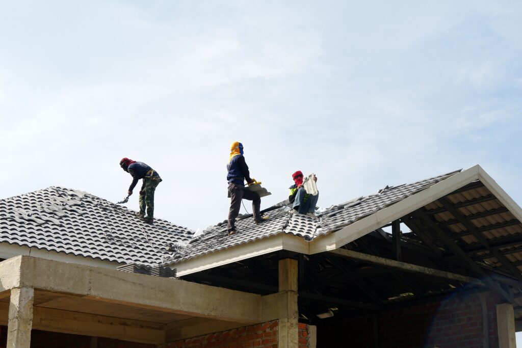roofers with gray cement roof tiles