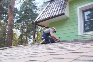 a worker repairs a soft roof