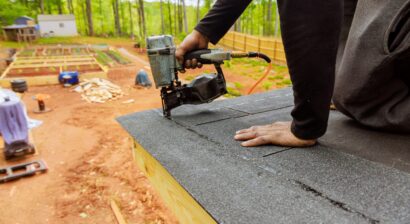 installing new asphalt shingles to roof