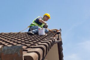 worker repairing roof