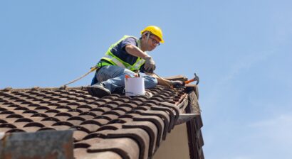 worker repairing roof