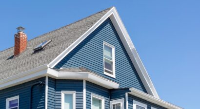 blue sided gable roof against clear sky