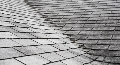 old composite roof with damage