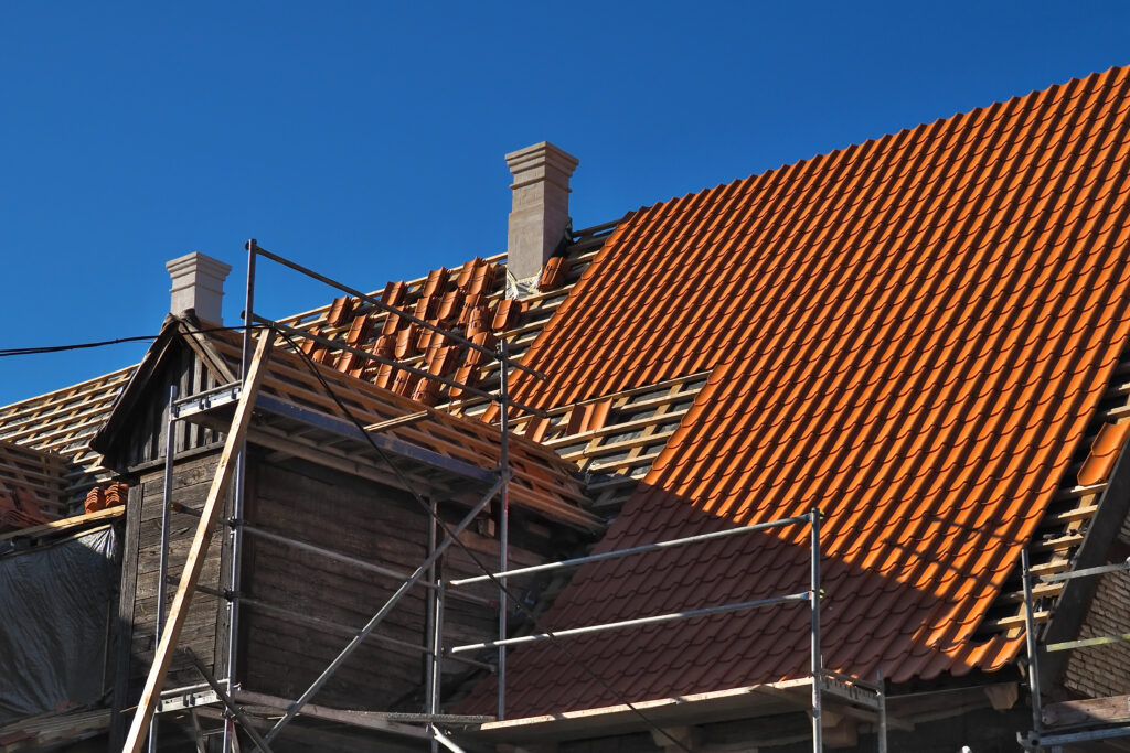 overhaul of old wooden building with a roof replacement