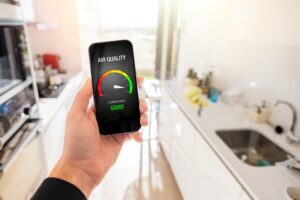 person in home viewing air quality index