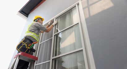 construction worker repairing the sliding window