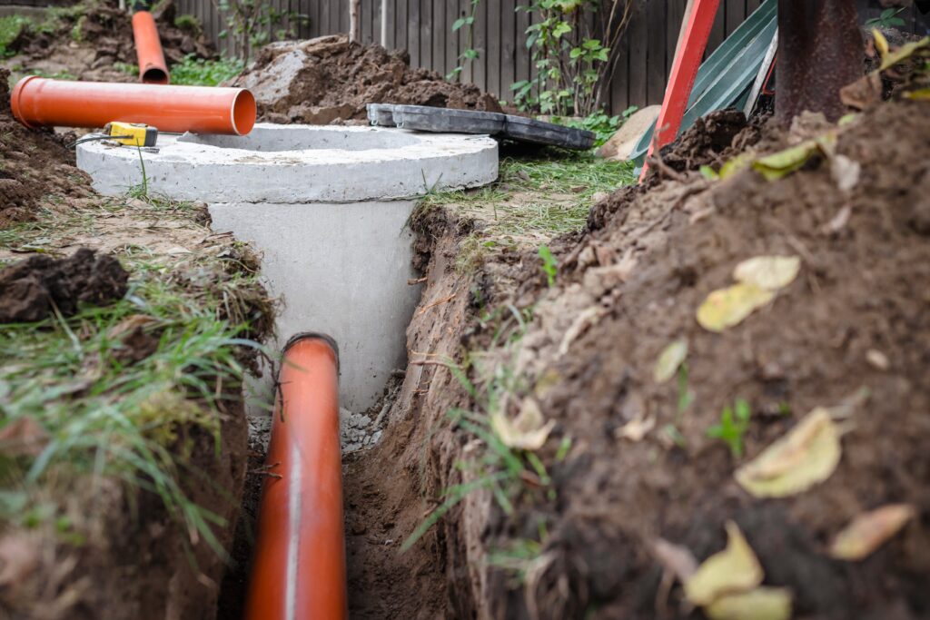 septic tank installation dug in sewer hole