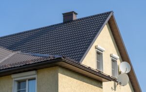 close up shot of a house with a black metal roof