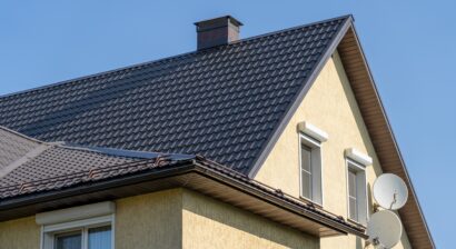 close up shot of a house with a black metal roof