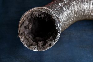 a dirty lanudry aluminum ductwork filled with lint