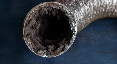 a dirty lanudry aluminum ductwork filled with lint