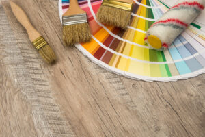 color paint guide and paint brush on wooden board