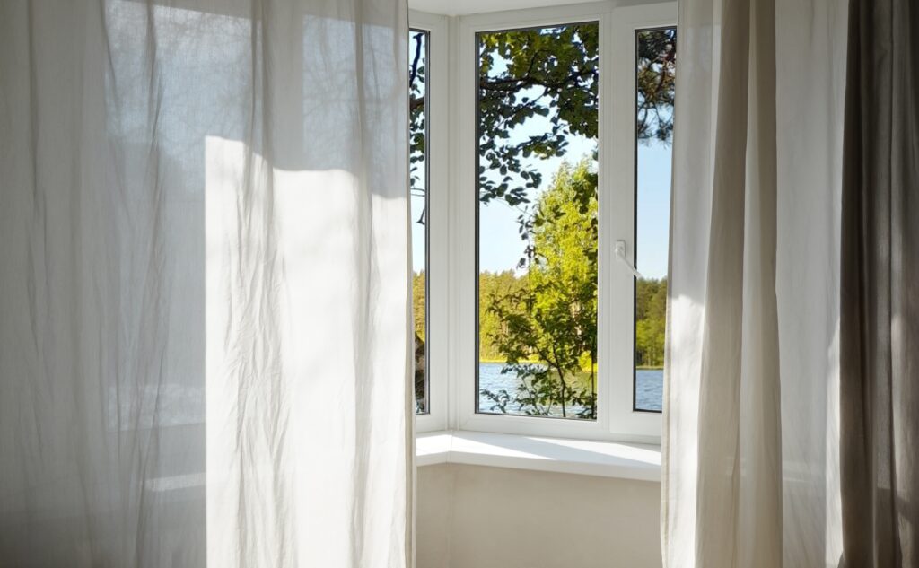 view from the window of green trees and landscape