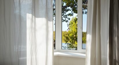 view from the window of green trees and landscape