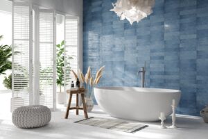 luxurious bathroom interior with white bathtub and blue walls