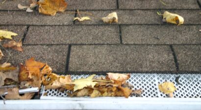 roof with gutter guard covered in leaves